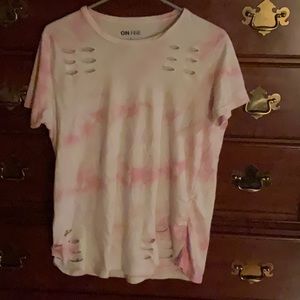 A pink and white tie dye with slits